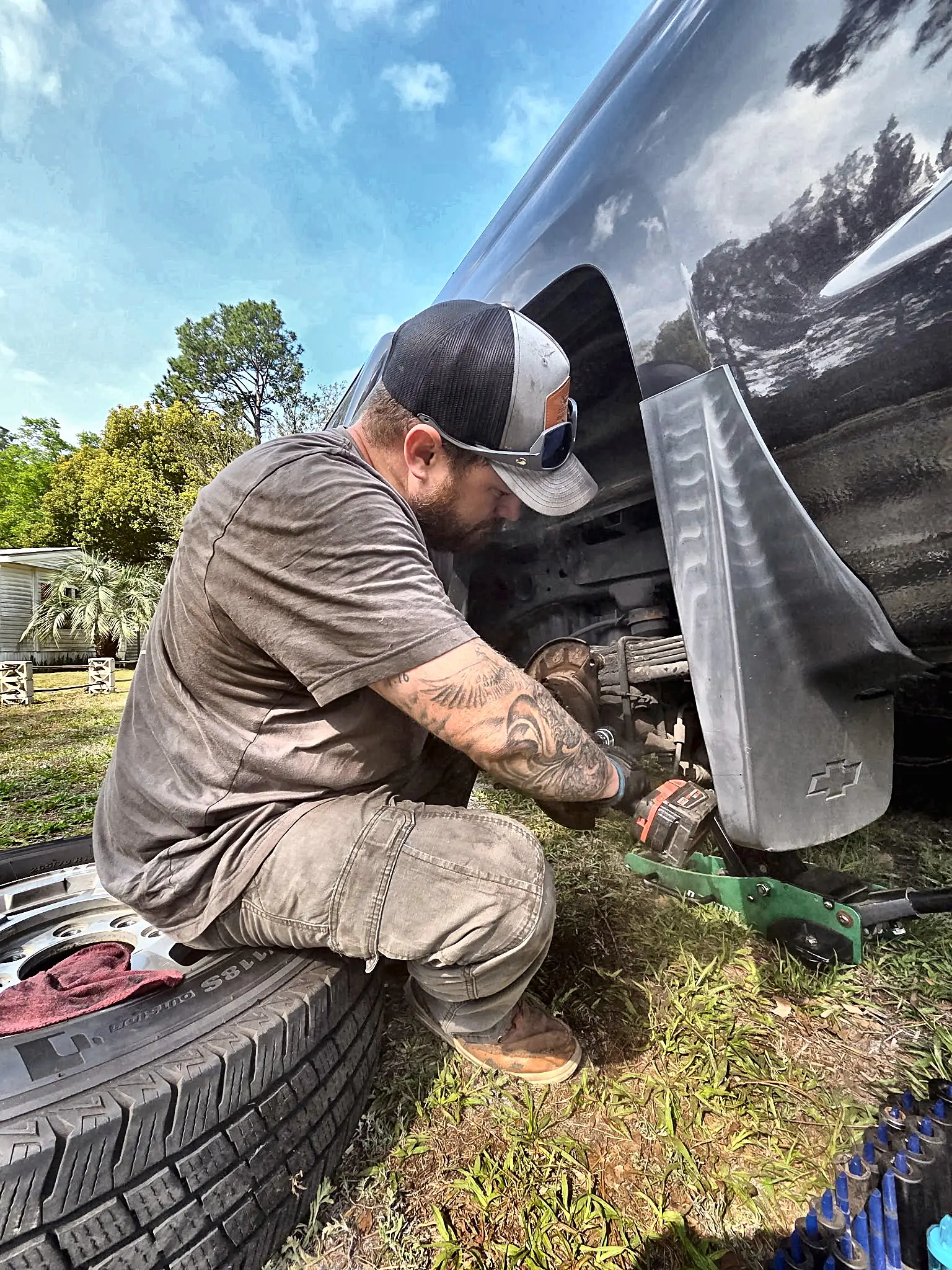 C&C mechanic working on a truck at a customer's home